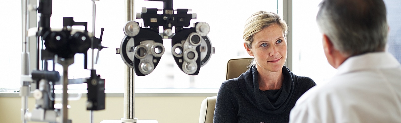 doctor speaking with a female patient about Eye Exams in Portland