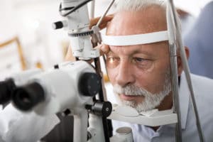 patient getting his eyes examined