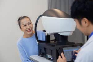 Asian senior woman examining eyesight